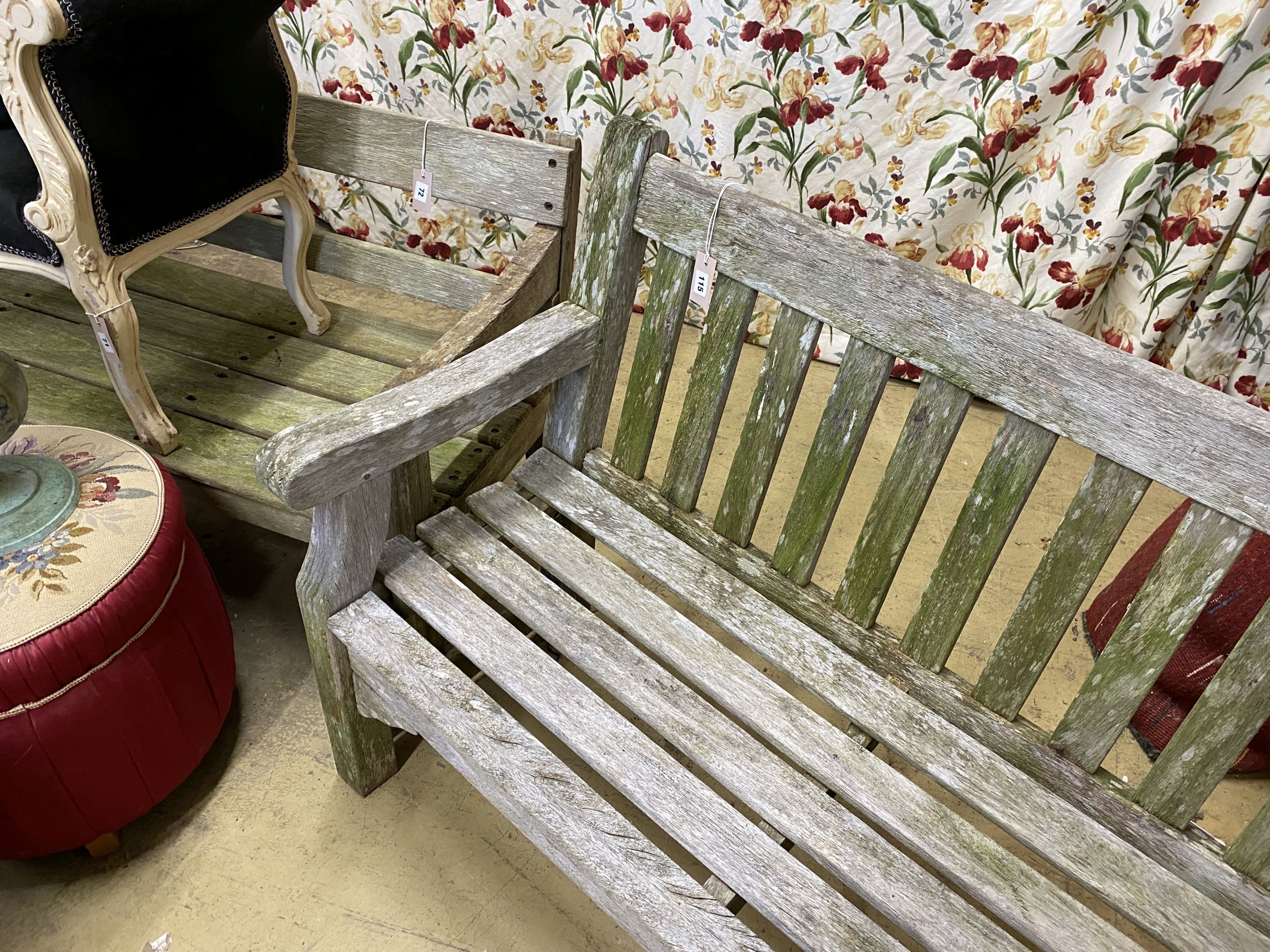 A weathered teak garden bench, length 182cm, depth 52cm, height 90cm